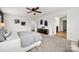 A bedroom with black accent cabinet, neutral decor, and cozy carpet at 8312 Compton Acres Ln, Waxhaw, NC 28173