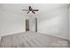 Spacious bedroom featuring neutral carpeting and a ceiling fan at 8312 Compton Acres Ln, Waxhaw, NC 28173