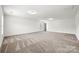 Large bonus room featuring neutral carpeting and lots of natural light at 8312 Compton Acres Ln, Waxhaw, NC 28173