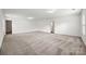 Spacious bonus room with neutral carpet and light-filled ambiance at 8312 Compton Acres Ln, Waxhaw, NC 28173