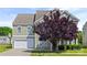 Charming two-story home with a two-car garage and lush landscaping at 8312 Compton Acres Ln, Waxhaw, NC 28173