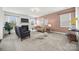 Cozy living room with a fireplace, plush seating, and stylish decor for relaxation at 8312 Compton Acres Ln, Waxhaw, NC 28173