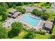 Aerial view of a community pool with lounge chairs, tables, and landscaping at 8312 Compton Acres Ln, Waxhaw, NC 28173