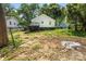Backyard featuring a wooden deck attached to the house and a spacious lawn at 909 Gibbons St, Gastonia, NC 28052