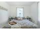 Bright bedroom with a bed, with decorative throw pillows and decor creating a serene space at 909 Gibbons St, Gastonia, NC 28052