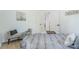 Comfortable bedroom with grey bedspread, a bench, and neutral wall art creating a serene space at 909 Gibbons St, Gastonia, NC 28052