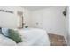 Bright and airy bedroom featuring a neutral decor, light hardwood floors, and calming natural light at 909 Gibbons St, Gastonia, NC 28052
