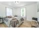 Bright bedroom with natural lighting, large bed, and a decorative throw pillow at 909 Gibbons St, Gastonia, NC 28052