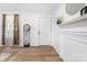 Bright entryway featuring a decorative mantle, luxury vinyl flooring, and soft natural light at 909 Gibbons St, Gastonia, NC 28052