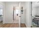 Hallway with bathroom featuring a shower, with an arrow on the wall at 909 Gibbons St, Gastonia, NC 28052