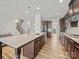 Spacious kitchen with granite counters, island with sink, and stainless steel appliances at 9582 Creighton Nw Rd, Concord, NC 28027