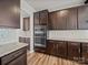 Gourmet kitchen featuring a double oven, granite countertops and a subway tile backsplash at 9582 Creighton Nw Rd, Concord, NC 28027