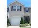 Inviting two-story home with a one-car garage and well-manicured landscaping at 9608 Brackenview Ct, Charlotte, NC 28214