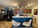 Modern kitchen with breakfast bar, stainless appliances, and ample cabinet space at 9608 Brackenview Ct, Charlotte, NC 28214