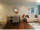 Cozy living area with hardwood floors, comfortable seating, and natural light at 9608 Brackenview Ct, Charlotte, NC 28214