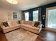 Inviting living room with hardwood floors and ample seating for entertaining at 9608 Brackenview Ct, Charlotte, NC 28214