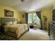 Serene bedroom featuring a comfortable bed, ample natural light, and stylish decor at 9608 Brackenview Ct, Charlotte, NC 28214