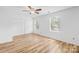 Bright bedroom with double windows, ceiling fan, and wood-look flooring at 9639 Green Gable Ct, Charlotte, NC 28270