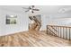 Open-concept living area with wood-look floors and lots of natural light at 9639 Green Gable Ct, Charlotte, NC 28270