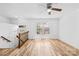 Bright living room with natural light, ceiling fan, and wood-look flooring at 9639 Green Gable Ct, Charlotte, NC 28270
