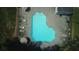 Aerial view of an outdoor community pool, with lounge chairs and umbrellas on the pool deck at 9639 Green Gable Ct, Charlotte, NC 28270