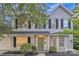 Charming two-story home with a light gray exterior, black shutters, and a well-manicured front yard at 11407 Lenswood Ct, Charlotte, NC 28214