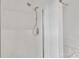 Shower featuring white tiles with glass door and chrome shower head at 11407 Lenswood Ct, Charlotte, NC 28214