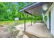 The spacious back patio features ample room for outdoor seating and entertaining, nestled in a lush, private backyard at 1224 E Woodlawn Rd, Charlotte, NC 28209