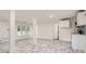 Open basement with modern vinyl flooring and a functional kitchenette, perfect for entertaining or Gathering gatherings at 1224 E Woodlawn Rd, Charlotte, NC 28209