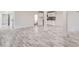 The open basement features modern vinyl flooring and a functional kitchenette, ideal for entertaining or Gathering gatherings at 1224 E Woodlawn Rd, Charlotte, NC 28209