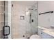 Bathroom featuring a glass shower, white vanity, and modern fixtures at 1224 E Woodlawn Rd, Charlotte, NC 28209