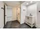 Clean and contemporary bathroom design with a stand-up shower and dark floors at 1224 E Woodlawn Rd, Charlotte, NC 28209