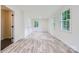 Spacious bedroom featuring large windows and hardwood floors at 1224 E Woodlawn Rd, Charlotte, NC 28209