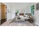 Bedroom with a comfortable bed, carpet, and two windows for ample natural light at 1224 E Woodlawn Rd, Charlotte, NC 28209