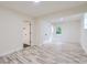 Spacious bedroom with sleek flooring, closet and a window offering plenty of natural light at 1224 E Woodlawn Rd, Charlotte, NC 28209