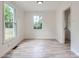 Well-lit dining area with hardwood floors and a bright, airy feel at 1224 E Woodlawn Rd, Charlotte, NC 28209