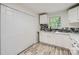Updated kitchen with ample counter space, white cabinets, and sleek backsplash at 1224 E Woodlawn Rd, Charlotte, NC 28209