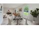 Bright living room showcasing modern furniture, large windows, and an open floor plan at 1224 E Woodlawn Rd, Charlotte, NC 28209