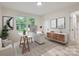 Office with a modern white desk and light wood accents offering a bright and functional workspace at 1224 E Woodlawn Rd, Charlotte, NC 28209