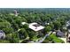 Scenic aerial view captures the charming condo community surrounded by lush trees and well-manicured landscaping at 1300 Queens Rd # 409, Charlotte, NC 28207