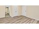 Bedroom with wood-look floors, closet, and access to hallways at 1300 Queens Rd # 409, Charlotte, NC 28207