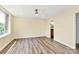 Bright bedroom with ceiling fan, hardwood floors, and natural light at 1300 Queens Rd # 409, Charlotte, NC 28207