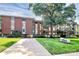 Brick condo building with mature landscaping, a manicured lawn, and convenient parking in a desirable location at 1300 Queens Rd # 409, Charlotte, NC 28207