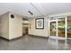Well lit hallway with tile floor, elevator and glass doors at 1300 Queens Rd # 409, Charlotte, NC 28207