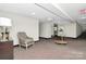 The condo building hallway features stylish decor, neutral tones, and an elevator, providing a welcoming and elegant ambiance at 1300 Queens Rd # 409, Charlotte, NC 28207