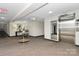Well lit hallway with a patterned carpet, elevator and decor at 1300 Queens Rd # 409, Charlotte, NC 28207
