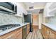 Updated kitchen featuring stainless steel appliances, custom backsplash, and modern fixtures at 1300 Queens Rd # 409, Charlotte, NC 28207
