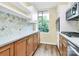 Beautiful updated kitchen with stainless appliances, unique backsplash, and new cabinets at 1300 Queens Rd # 409, Charlotte, NC 28207