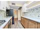 Modern kitchen with stainless steel appliances, ample counter space, and stylish backsplash at 1300 Queens Rd # 409, Charlotte, NC 28207