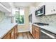 Charming kitchen with modern appliances, stylish backsplash, and plenty of cabinet space at 1300 Queens Rd # 409, Charlotte, NC 28207